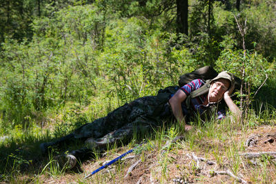 Portrait of man lying on land