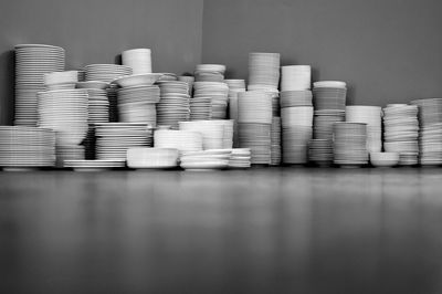 Stack of bowls and plates against wall