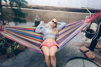 Portrait of woman lying in hammock