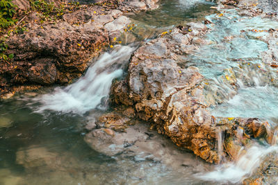 High angle view of water flowing in stream