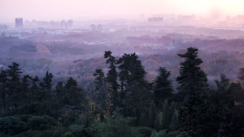 High angle view of cityscape against cloudy sky