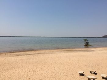 Scenic view of beach against clear sky