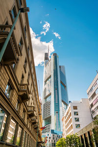 Low angle view of buildings against blue sky