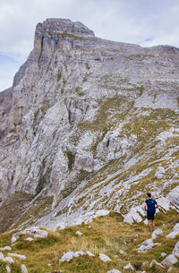Full length of man standing on rocky landscape