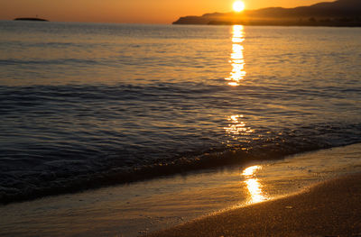 Scenic view of sea against sky at sunset