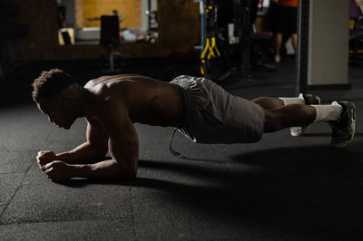 Low section of woman exercising in gym