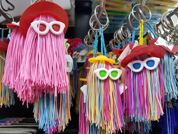 Close-up of colorful personal accessories hanging for sale in market