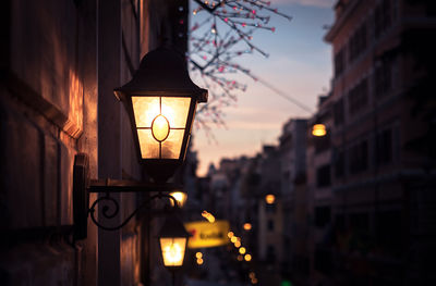 Close-up of illuminated street light at night