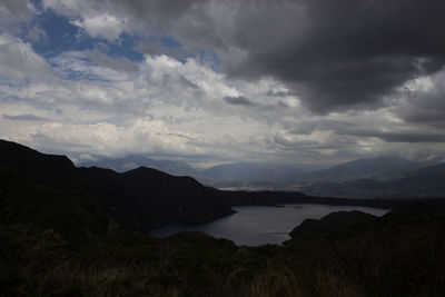 Scenic view of lake and mountains against sky