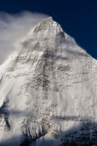 Scenic view of snowcapped mountain against sky