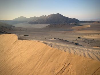 Scenic view of desert against clear sky