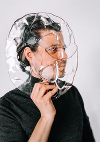 Portrait of young man wearing mask