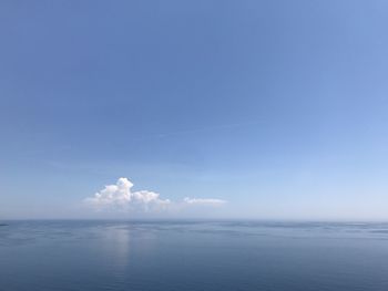 Scenic view of sea against blue sky