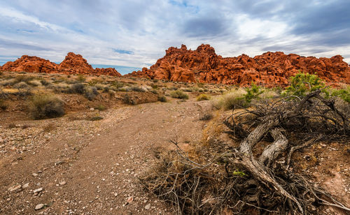 Rock formations on landscape against sky