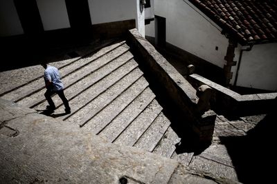 High angle view of man standing on staircase