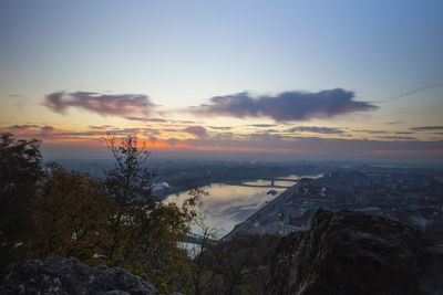 High angle view of buildings against sky during sunset