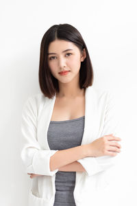 Portrait of a beautiful young woman over white background