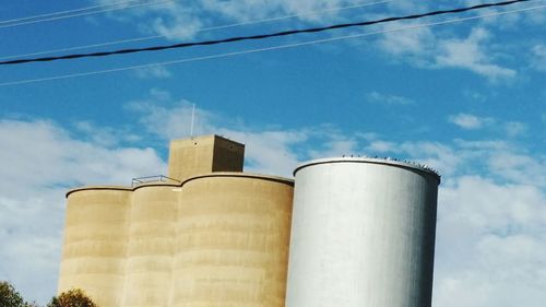 Low angle view of smoke stack against sky