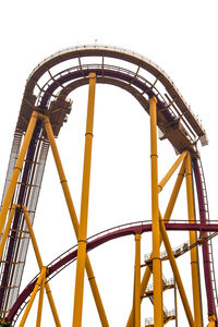 Low angle view of rollercoaster against clear sky