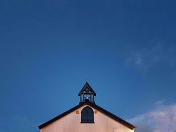 Low angle view of building against blue sky