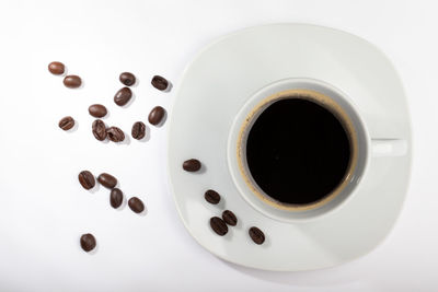 Directly above shot of coffee cup over white background