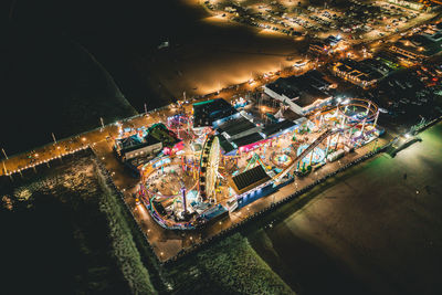 High angle view of illuminated city buildings at night