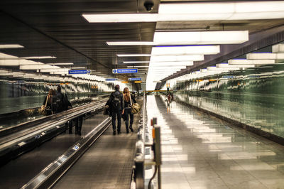 Rear view of people at airport