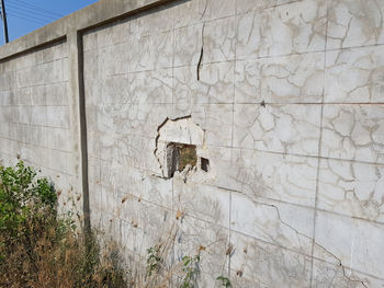Damaged wall against building