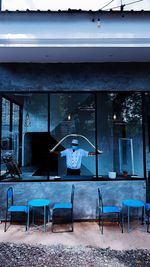 Man sitting on bench in restaurant