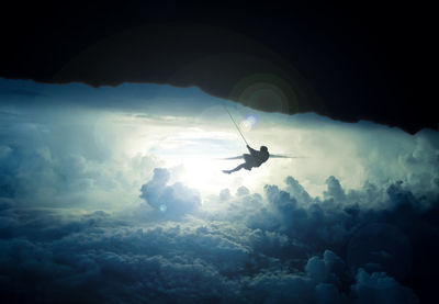 Low angle view of bird flying in sky