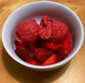 High angle view of strawberries in bowl on table