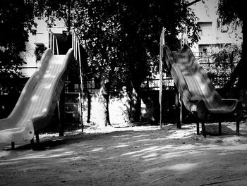 Low angle view of swing ride in park