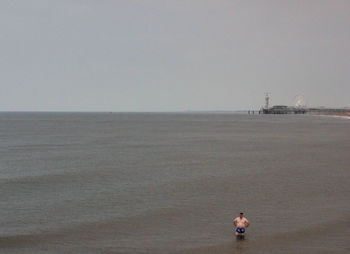 Man on beach against sky