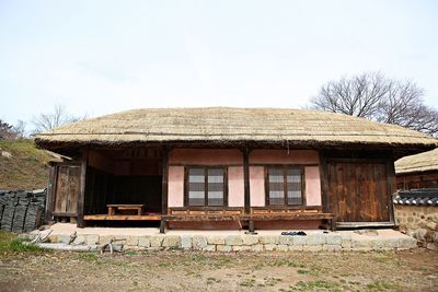 House on field against sky