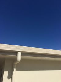 Low angle view of built structure against clear blue sky