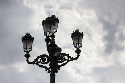 Low angle view of street light against sky