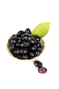 Close-up of grapes against white background