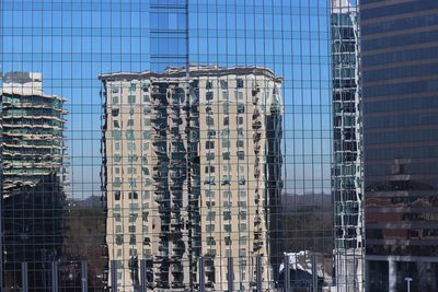 Reflection of buildings on glass window