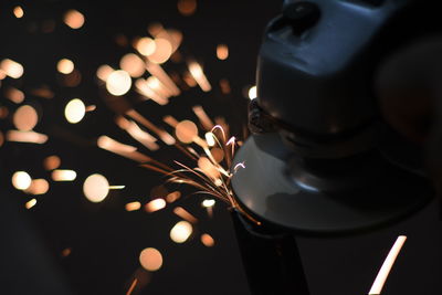 Close-up of illuminated lighting equipment