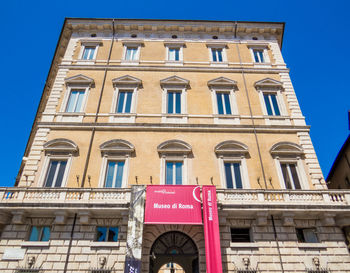 Low angle view of building against blue sky