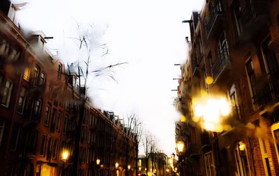 Low angle view of buildings at sunset