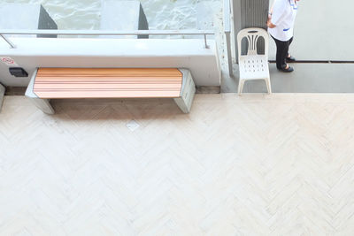 Low section of woman standing on hardwood floor