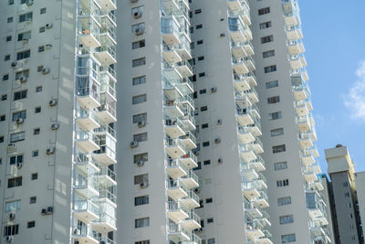 Low angle view of buildings in city against sky