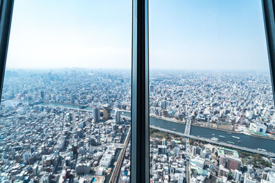 High angle view of city buildings against sky