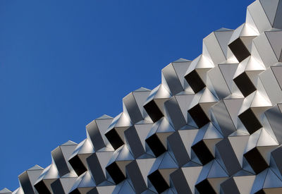 Low angle view of built structure against blue sky