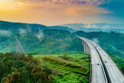 High angle view of cars on road against sky