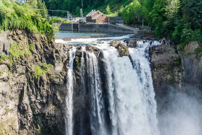 Water over the edge of snoqualmie falls in washington state.