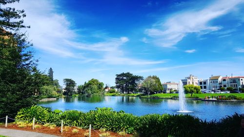 Scenic view of calm lake against cloudy sky