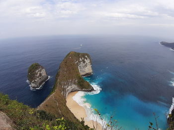 High angle view of rocks in sea against sky