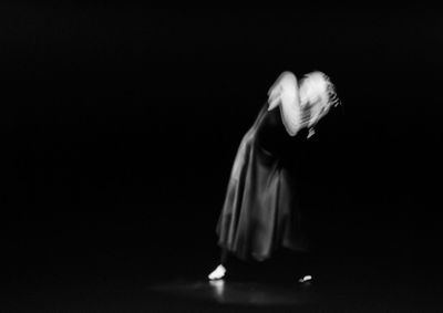 Close-up of hands over black background